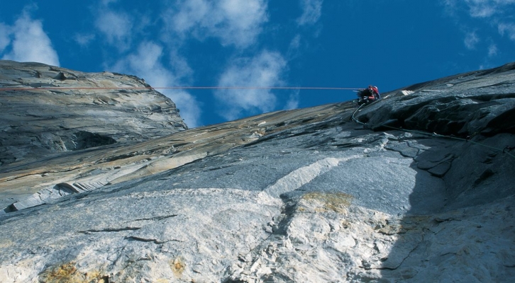 A climber on a granite mountain face